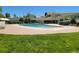 Large outdoor swimming pool with lounge area and lush landscaping at 715 S Alton Way # 10A, Denver, CO 80247