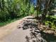 Walking path with mature trees lining the road at 715 S Alton Way # 10A, Denver, CO 80247