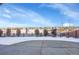 Large, snowy backyard with a view of neighboring houses at 4439 Mcmurdo Ct, Castle Rock, CO 80108