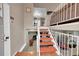 Two-story entryway with hardwood floors and a wooden staircase at 5737 S Odessa St, Centennial, CO 80015