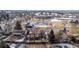 Aerial shot shows a residential neighborhood with mature trees, and nearby recreational facilities, including a pool and park at 9430 Perry St, Westminster, CO 80031