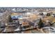 Aerial shot shows a residential neighborhood with mature trees, and nearby recreational facilities, including a pool and park at 9430 Perry St, Westminster, CO 80031