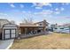 Beautiful backyard featuring a shed, covered patio with furniture, and a well-kept lawn at 9430 Perry St, Westminster, CO 80031