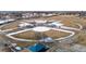 Aerial shot of multi-field ball park in the community with walking paths and shelters in winter setting at 9430 Perry St, Westminster, CO 80031