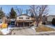 Charming two-story home features brick accents, dual car garage and a well-maintained front yard at 9430 Perry St, Westminster, CO 80031