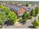 A beautiful aerial view of a red brick home nestled in a lush, green, landscaped neighborhood at 11791 Bradburn Blvd, Westminster, CO 80031