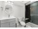 Neutrally-toned bathroom includes a glass enclosed shower and sleek vanity at 11791 Bradburn Blvd, Westminster, CO 80031
