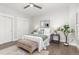Cozy bedroom showcasing hardwood floors, soft rug, white bedding, and a serene, inviting atmosphere at 11791 Bradburn Blvd, Westminster, CO 80031