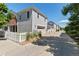Charming townhouse with a two-car garage, white picket fence, and well-maintained landscaping at 11791 Bradburn Blvd, Westminster, CO 80031