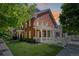 Charming two-story brick home with manicured lawn and classic white picket fence detail at 11791 Bradburn Blvd, Westminster, CO 80031