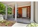 Inviting front porch with classic columns, rocking chairs, and a white picket fence detail at 11791 Bradburn Blvd, Westminster, CO 80031