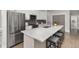 Modern kitchen featuring a large island, stainless steel appliances, and ample counter space at 11791 Bradburn Blvd, Westminster, CO 80031