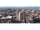 Aerial view of the property and surrounding neighborhood, showcasing mountain views at 65 N Logan St # B4, Denver, CO 80203