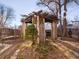 Cozy backyard patio with pergola, table, chairs, and grill at 65 N Logan St # B4, Denver, CO 80203