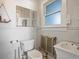 Clean bathroom with toilet, sink, and vintage radiator at 65 N Logan St # B4, Denver, CO 80203