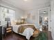 Bright bedroom with a comfortable bed and a view of the living room at 65 N Logan St # B4, Denver, CO 80203