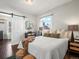 Main bedroom with a cozy bed and access to the bathroom at 65 N Logan St # B4, Denver, CO 80203