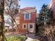 Brick two-story home with a light-colored door and steps at 65 N Logan St # B4, Denver, CO 80203