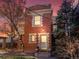 Brick two-story home with a light-colored door and steps at 65 N Logan St # B4, Denver, CO 80203