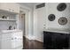 White kitchen cabinets, black appliances, and gray countertops at 65 N Logan St # B4, Denver, CO 80203