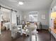 Bright living room with hardwood floors, comfy seating, and a view into the bedroom at 65 N Logan St # B4, Denver, CO 80203