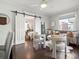 Living room features hardwood floors, a cozy couch, and sliding barn doors to the bedroom at 65 N Logan St # B4, Denver, CO 80203