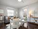 Bright living room showcasing modern decor, large windows, and comfortable seating area at 65 N Logan St # B4, Denver, CO 80203