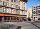 Street-level view of Broadway featuring restaurants and businesses at 65 N Logan St # B4, Denver, CO 80203