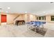 Spacious finished basement with a ping pong table, foosball table and plenty of room for activities at 16416 E Powers Pl, Centennial, CO 80015