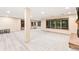 Finished basement with recessed lighting, brick fireplace, carpeted flooring, and a wall of windows at 16416 E Powers Pl, Centennial, CO 80015