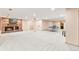 Spacious finished basement with a brick fireplace and entertainment area at 16416 E Powers Pl, Centennial, CO 80015