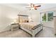 Cozy bedroom featuring a ceiling fan and a well-lit window, creating a relaxing atmosphere at 16416 E Powers Pl, Centennial, CO 80015