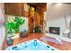 Hot tub room with wood walls, spiral staircase and fireplace for ultimate relaxation and comfort at 16416 E Powers Pl, Centennial, CO 80015