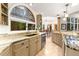 Well-lit kitchen with granite countertops, cabinetry, stainless steel dishwasher, and a picturesque window at 16416 E Powers Pl, Centennial, CO 80015