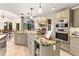 Open kitchen featuring granite countertops, stainless steel appliances, and seamless flow into the living space at 16416 E Powers Pl, Centennial, CO 80015