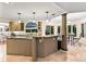 Spacious kitchen with granite countertops, neutral cabinetry, and views of the breakfast nook and backyard at 16416 E Powers Pl, Centennial, CO 80015