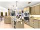 Open kitchen featuring granite countertops, stainless steel appliances, and seamless flow into the living space at 16416 E Powers Pl, Centennial, CO 80015