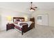 Comfortable main bedroom with vaulted ceiling, ceiling fan and access to a relaxing hot tub at 16416 E Powers Pl, Centennial, CO 80015