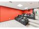 Finished home theatre room with comfortable leather seating and a large screen at 16416 E Powers Pl, Centennial, CO 80015