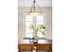Bright dining area featuring an elegant light fixture and a decorative vase at 9000 W 4Th Pl, Lakewood, CO 80226
