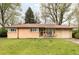 Charming one-story brick home with a well-manicured lawn and inviting front porch at 9000 W 4Th Pl, Lakewood, CO 80226