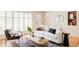 Bright living room with large windows, stylish furniture, and a cozy atmosphere at 9000 W 4Th Pl, Lakewood, CO 80226