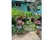 Beautiful backyard garden with stepping stones among plants, creating a tranquil outdoor space at 3831 S Hillcrest Dr, Denver, CO 80237