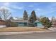 Charming single-story home features a well-maintained lawn and mature trees at 3831 S Hillcrest Dr, Denver, CO 80237