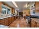 Large kitchen with stainless steel appliances and tile flooring at 3831 S Hillcrest Dr, Denver, CO 80237