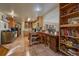 Spacious kitchen with tiled floor, bright cabinets and adjacent dining area at 3831 S Hillcrest Dr, Denver, CO 80237