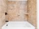 Clean bathroom with tile shower/tub combo and neutral tones at 5385 Camargo Rd, Littleton, CO 80123