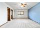 Main bedroom with ceiling fan and access to bathroom at 5385 Camargo Rd, Littleton, CO 80123