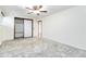 Bright bedroom featuring ceiling fan and ample closet space at 5385 Camargo Rd, Littleton, CO 80123