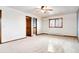 Main bedroom with ceiling fan and access to bathroom at 5385 Camargo Rd, Littleton, CO 80123